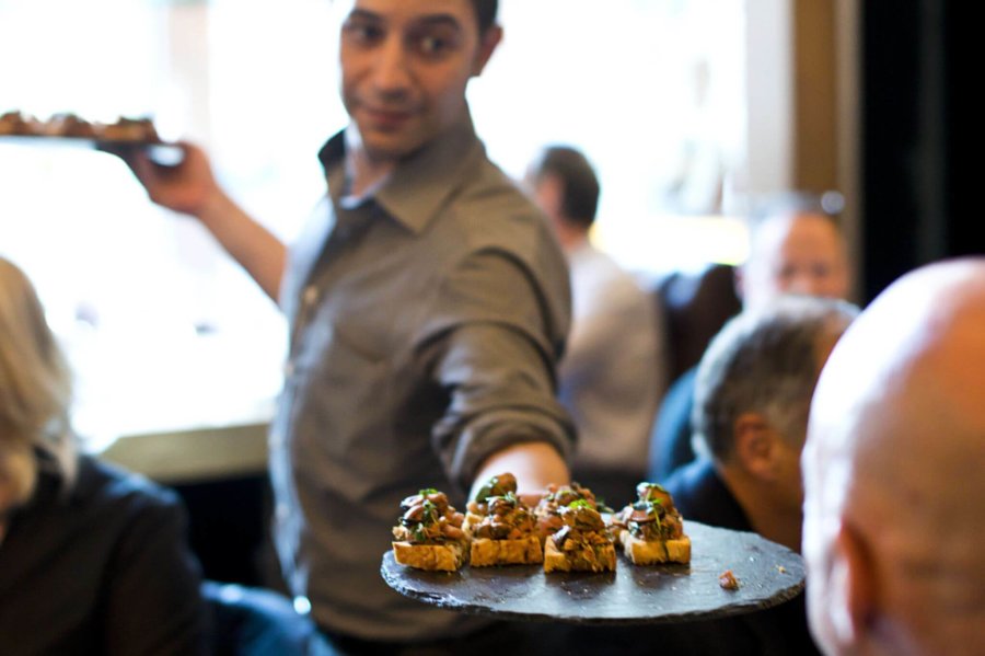 Waiter serving canapes