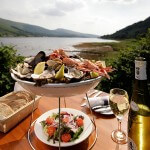 A selection of seafood with bread and wine