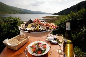A selection of seafood with bread and wine