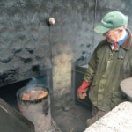 A man preparing the oak for food smoking