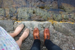 Image of 2 people standing by the waters edge